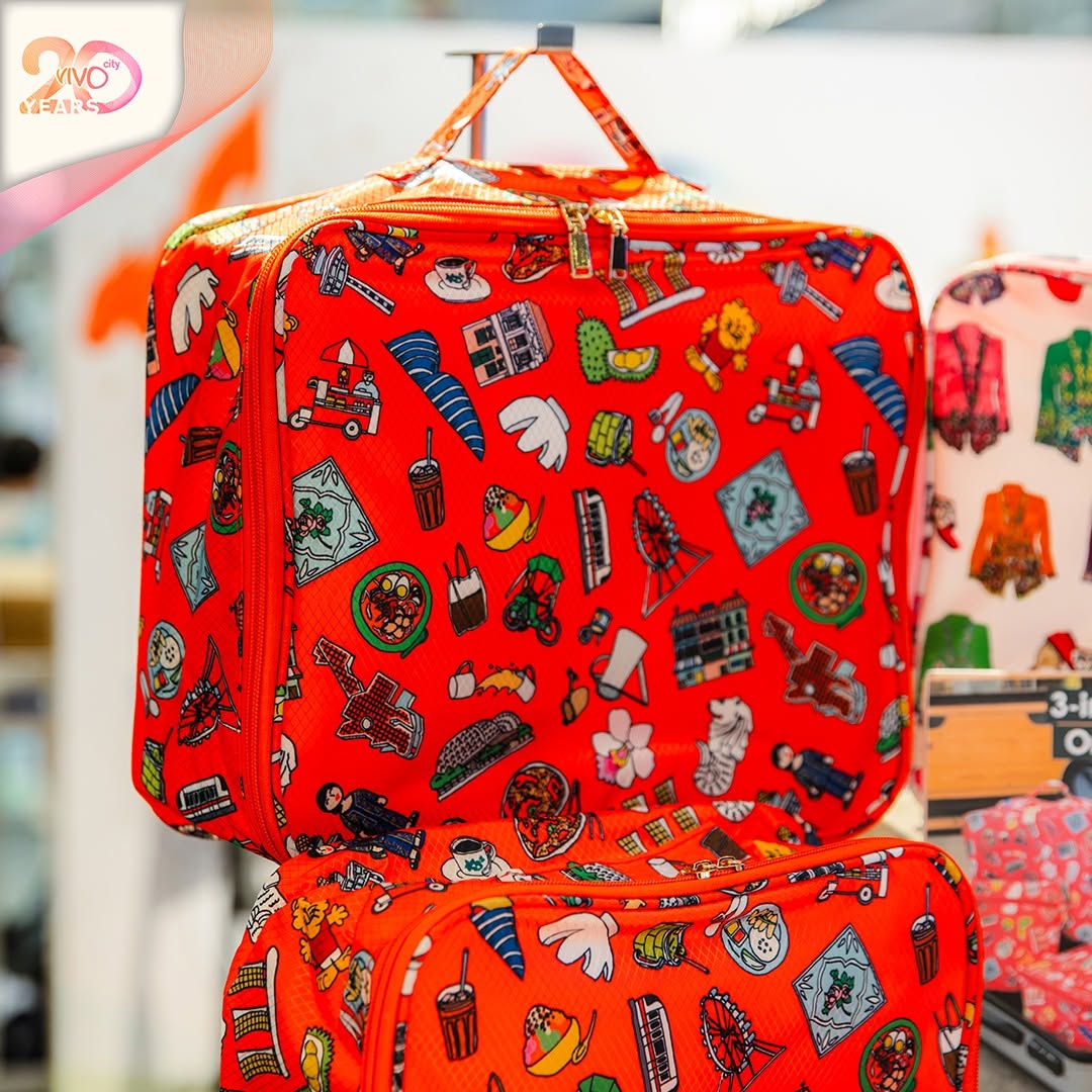 Red patterned travel bags with cartoon illustrations