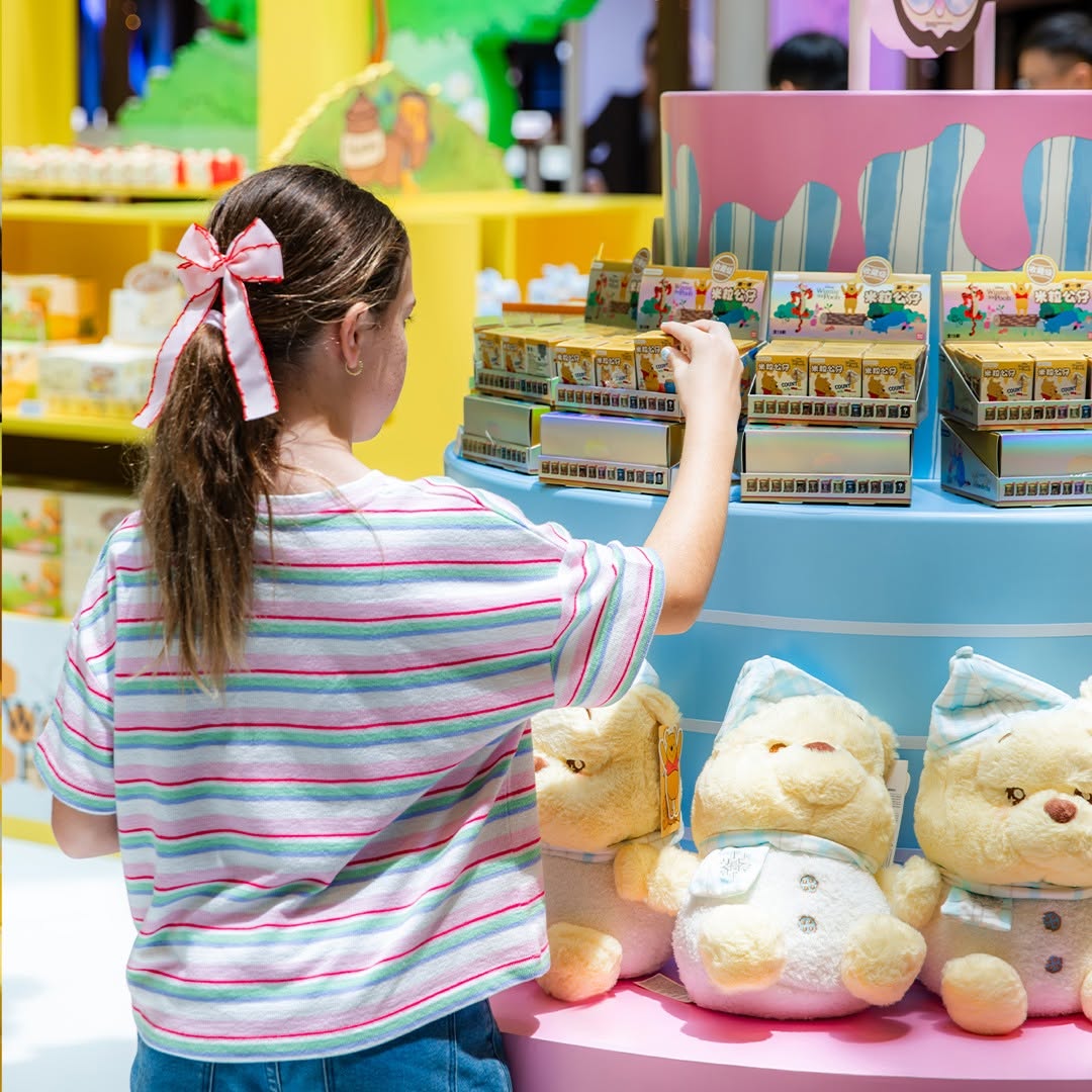 Blind box collectibles and plush bears at MINISO Winnie-the-Pooh pop-up