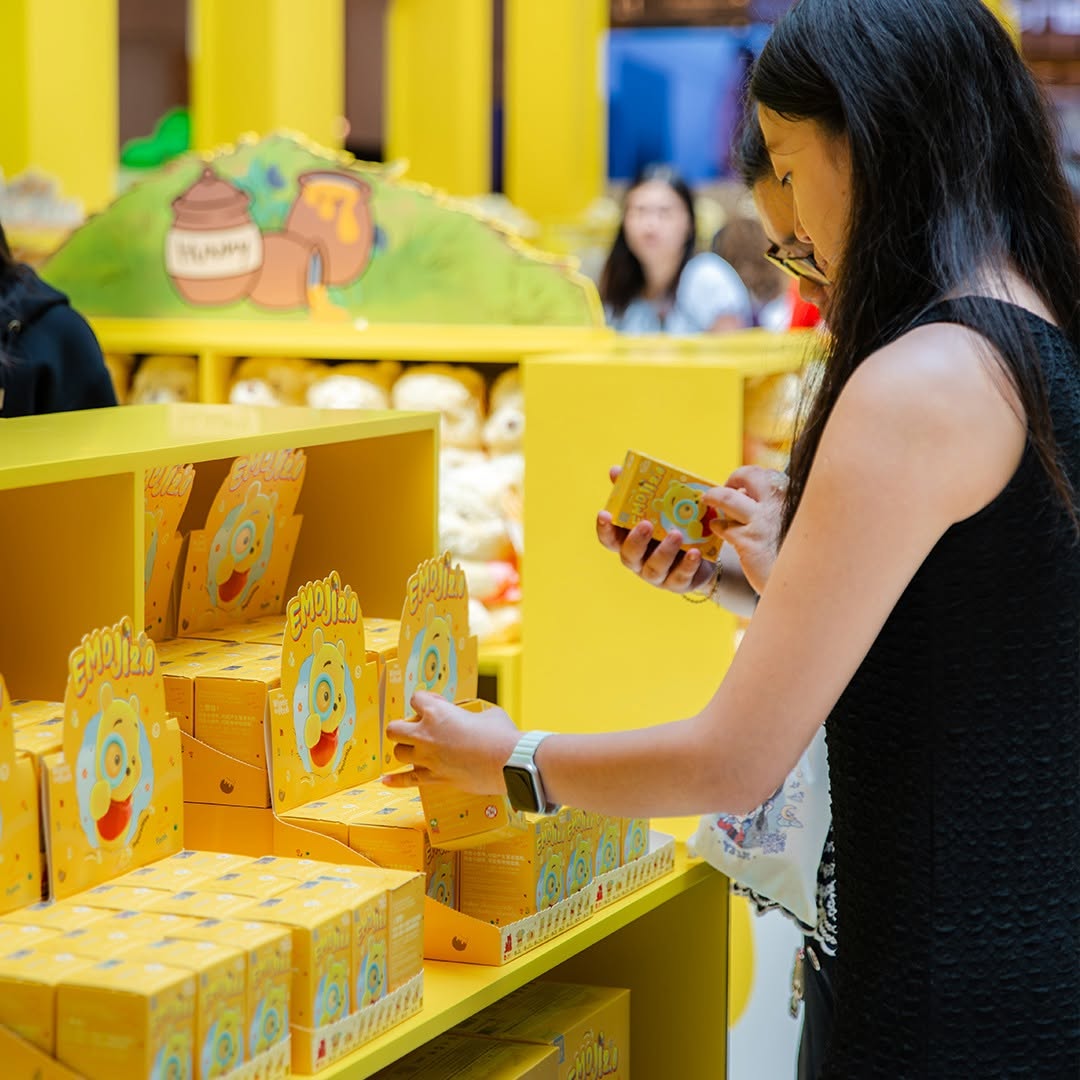 Enjinjo branded collectible boxes at MINISO Winnie-the-Pooh pop-up
