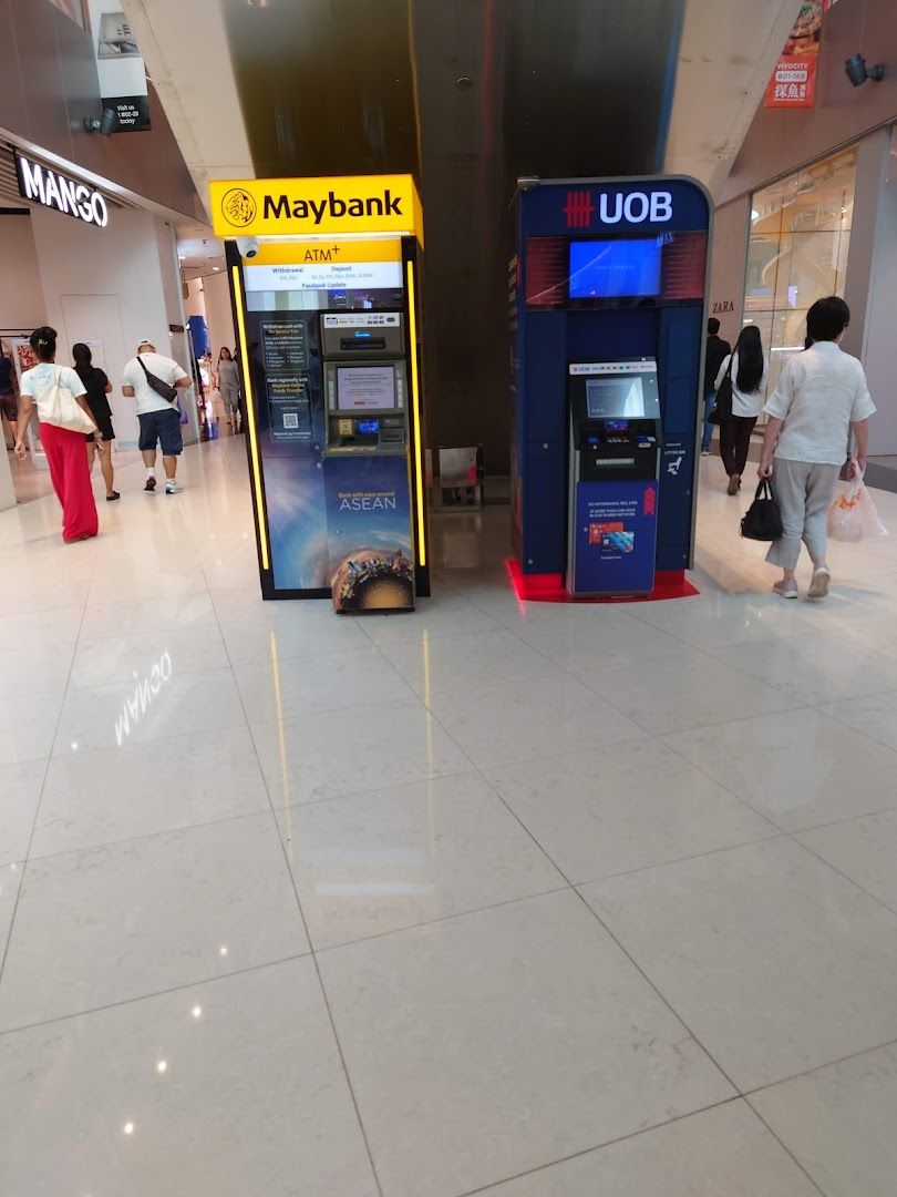 Two ATMs, one Maybank and one UOB, are located in a shopping mall.