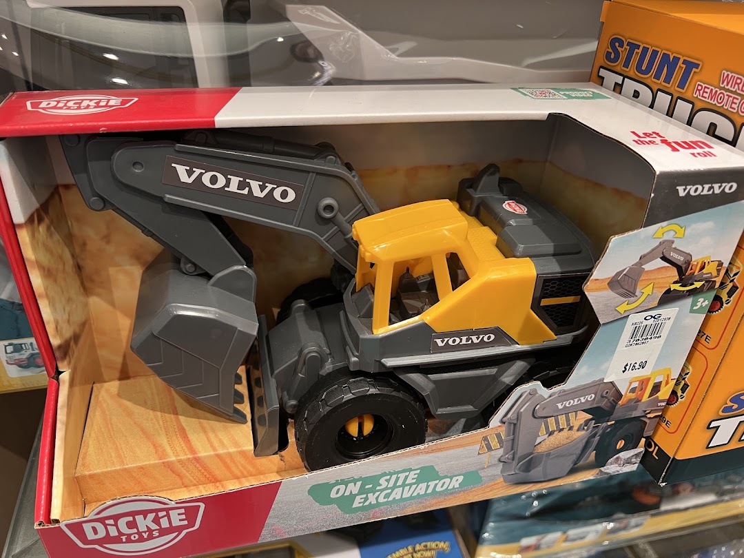 A boxed Dickie Toys Volvo on-site excavator toy with a price tag visible.