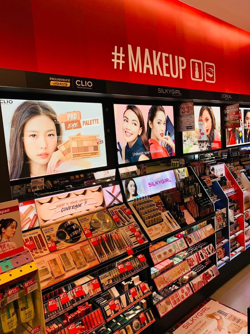 A brightly lit Watsons store section showcasing makeup products and promotions.